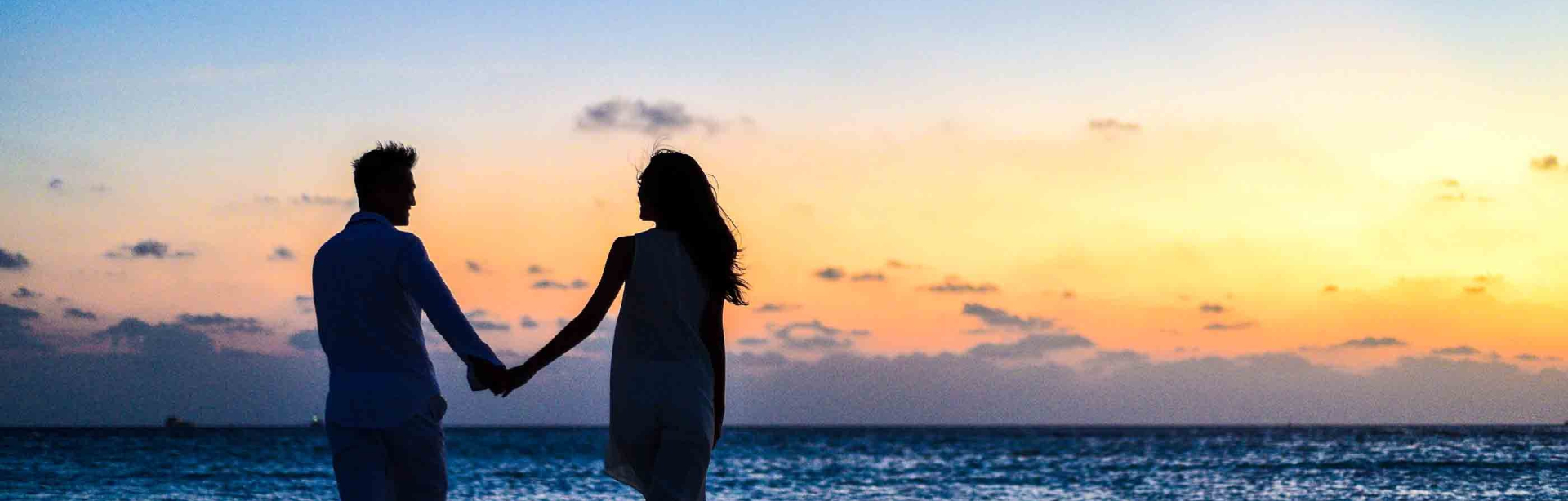 image of couple holding hands on the beach | Looking for Couple's Counseling in St. Petersburg, FL? How to know when you need couples counseling.