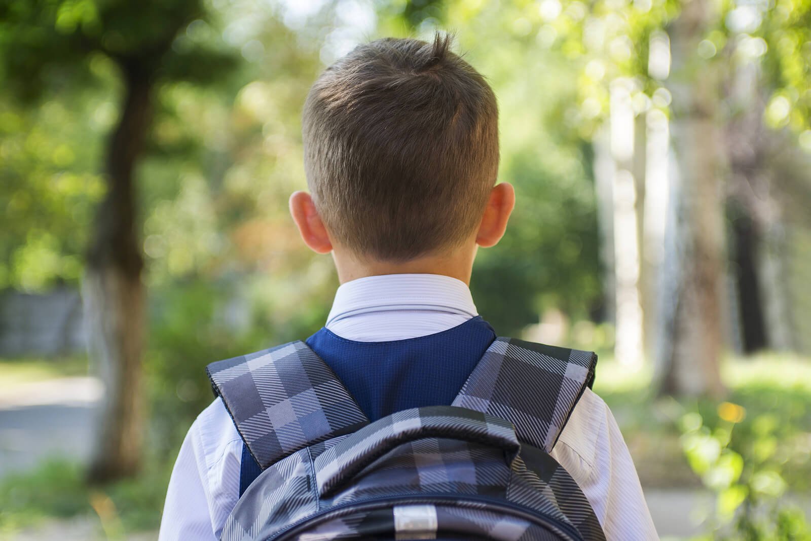 Photo of a young boy wearing a backpack going to school. Is your child struggling with a learning disability? Learn how a comprehensive exam in child neuropsych testing in Saint Petersburg, FL can help.