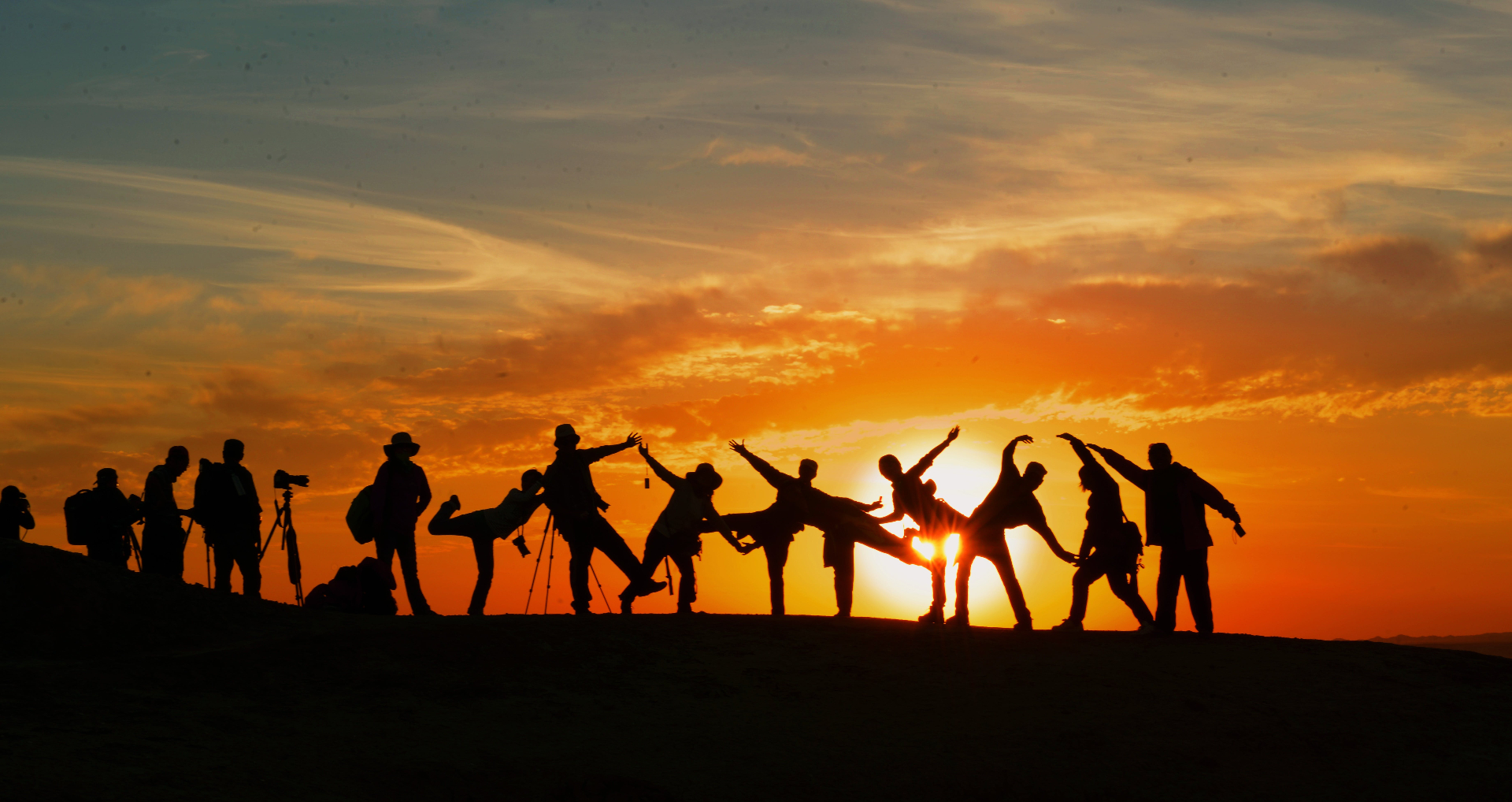 Image of a group of people dancing on top of a hill during the sunset. Do you struggle with holiday anxiety? Learn how anxiety therapy in Saint Petersburg, FL can help.