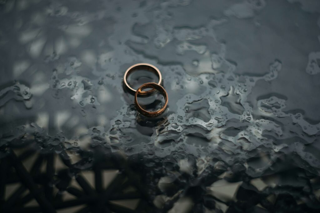 Two wedding rings set aside in the rain. Are you trying to heal from the end of a marriage you did not expect? Divorce Recovery Therapy can help you rebuild and navigate the changes. Call today to see how a St. Pete therapist can support you.